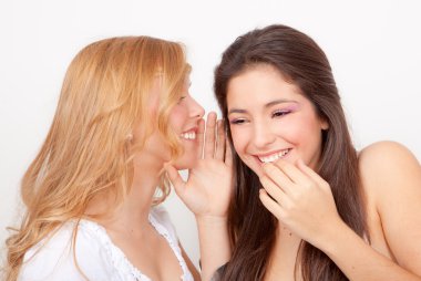 Teens whispering and gossiping clipart