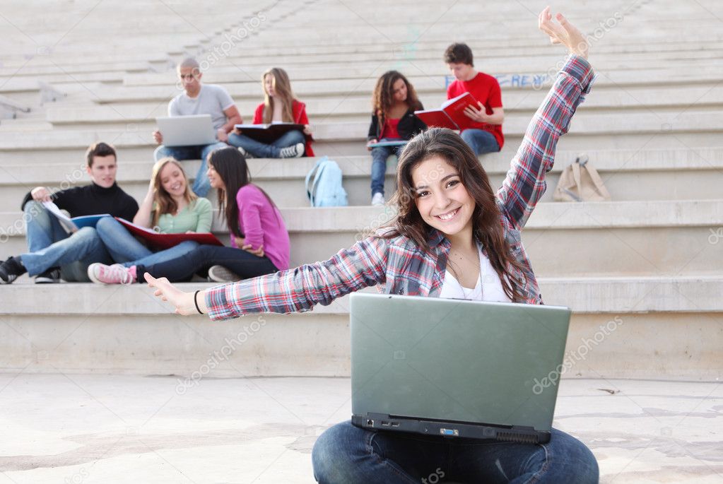 Students on campus working outdoors