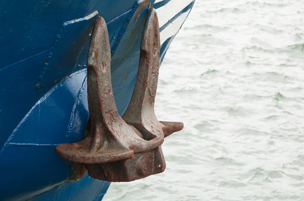 stock image Old rusty anchor at a board of the ship