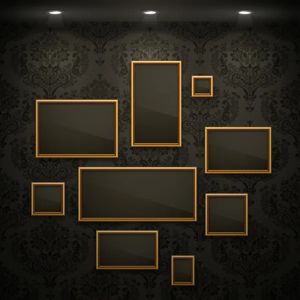 Gouden frames op de muur. — Stockvector