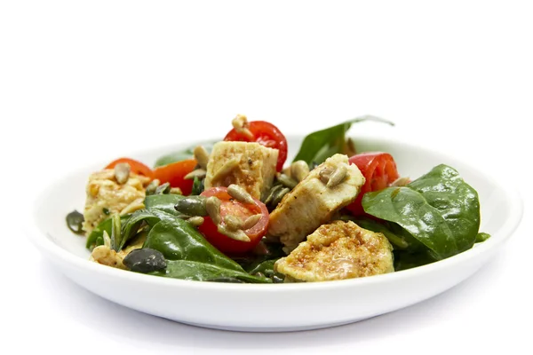 Spinazie en kip salade Stockfoto