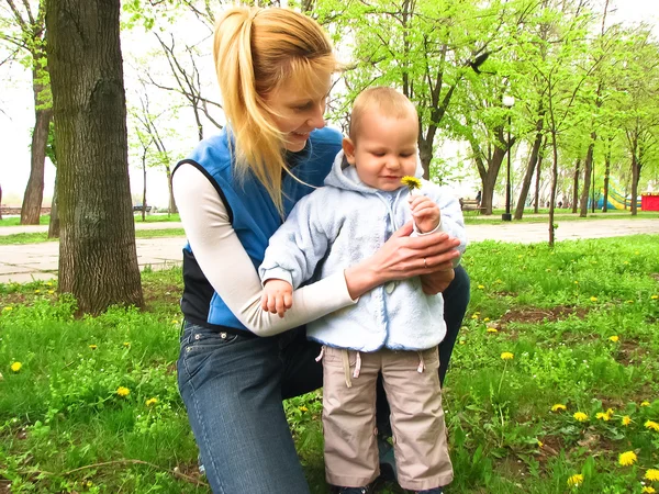 Mother and son on a walk in the Spring Park — Stock Photo, Image