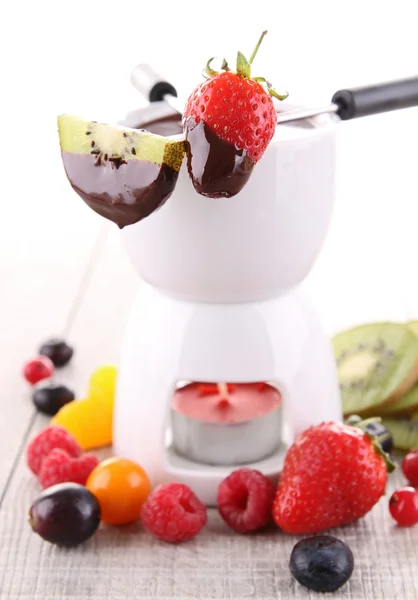 Chocolate fondue with fruits — Stock Photo, Image