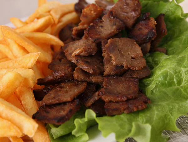 Stock image Grilled meat,french fried and vegetables