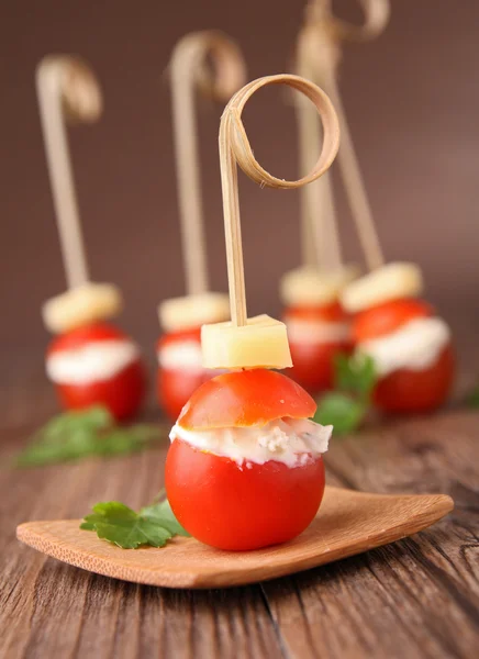 Appetizer, cherry tomato and cheese — Stock Photo, Image