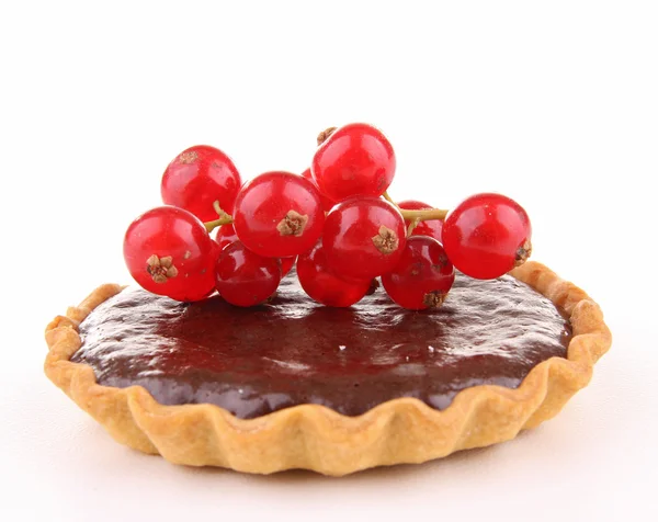 Isolated chocolate and red currant tart — Stock Photo, Image