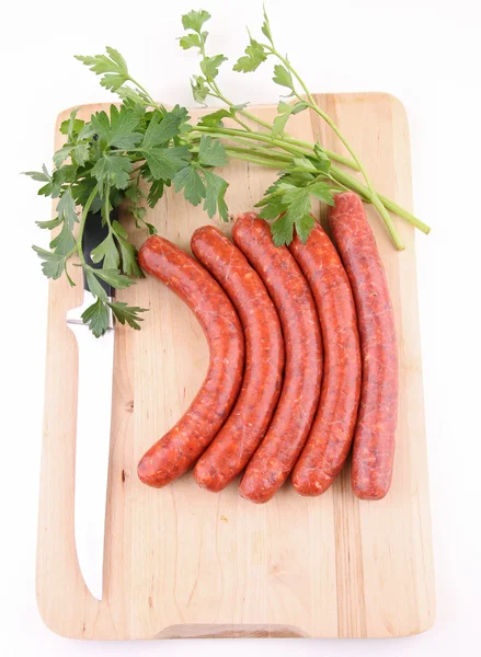 Isolated raw sausage and parsley — Stock Photo, Image