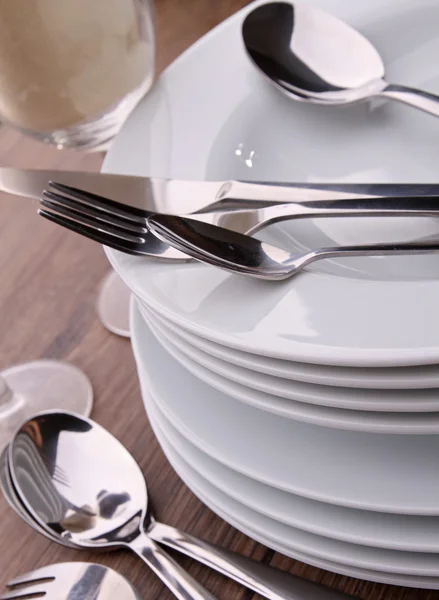 Plates pile and cutlery — Stock fotografie