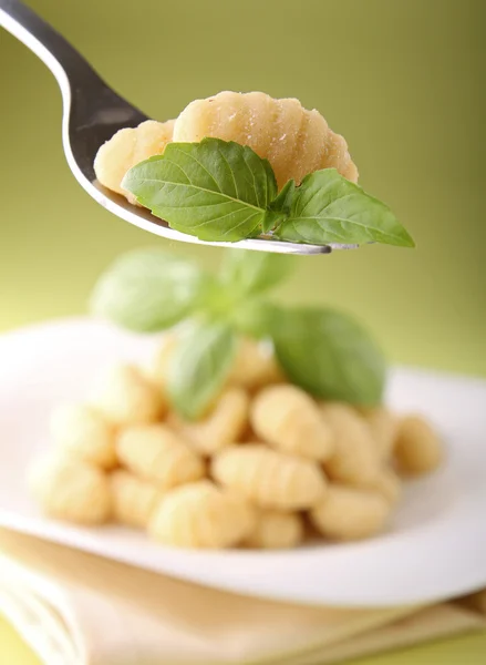 Gnocchi and basil — Stock Photo, Image