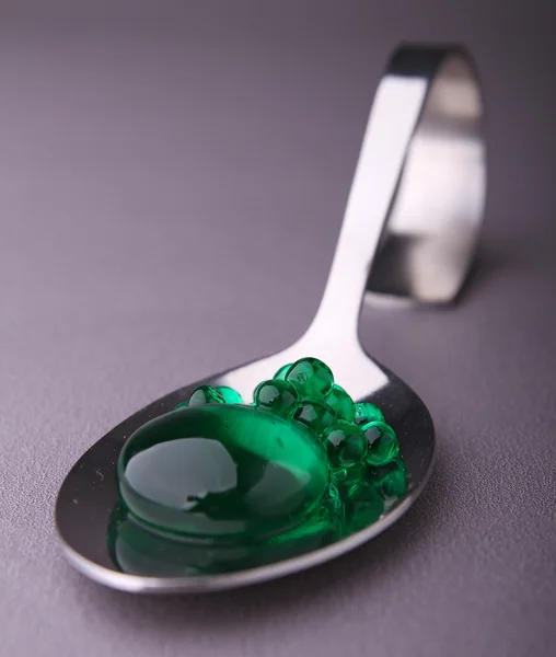 Spoon of molecular caviar Stock Photo