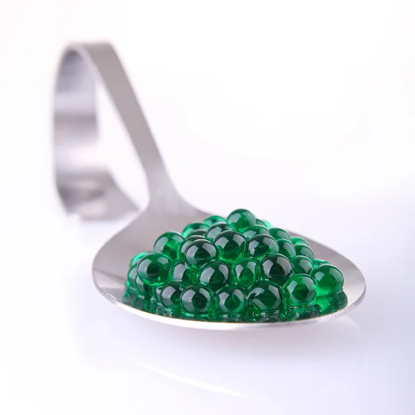 Spoon with mint caviar Stock Image