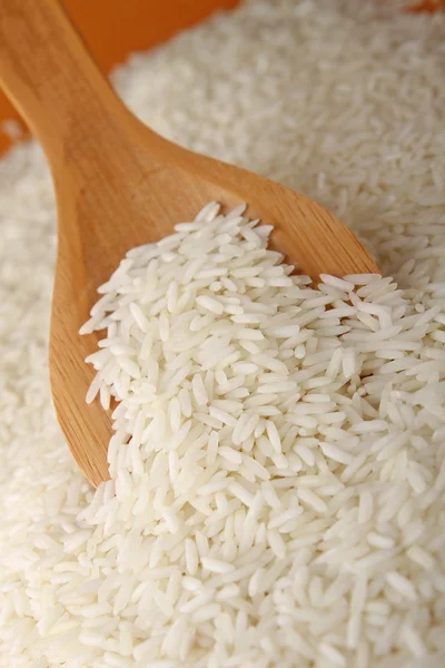 Raw rice and spoon — Stock Photo, Image