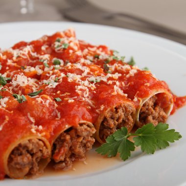 Cannelloni and tomato sauce clipart