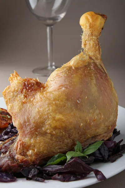 stock image Roast duck leg and vegetables