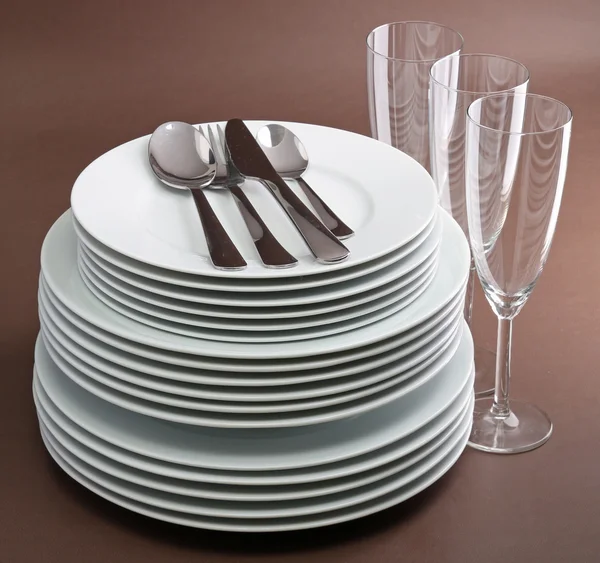 Plate stack,cutlery and glasses — Stock Photo, Image