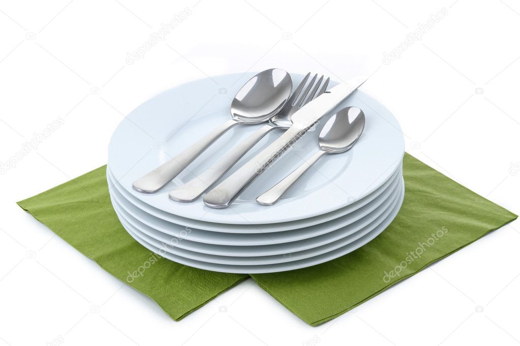 Isolated pile of plates and cutlery