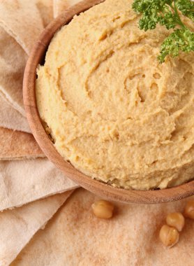 Closeup on hummus with pita bread clipart