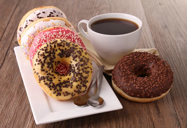 Donuts and coffee cup Stock Photo by ©studioM 9472377