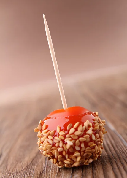 Toffee apple with sesam — Stock Photo, Image