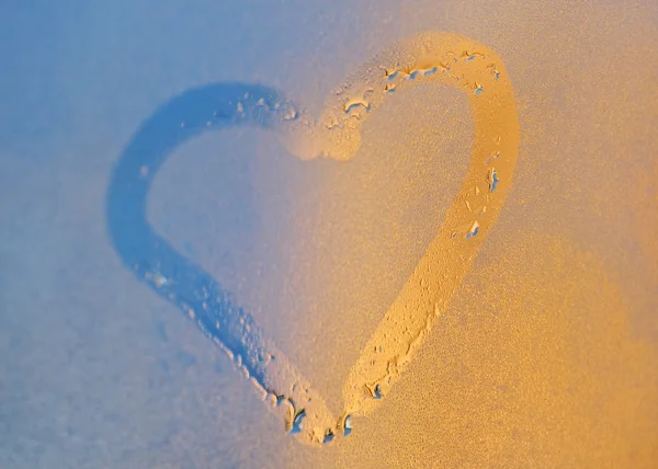 stock image Heart from dew drops on the window