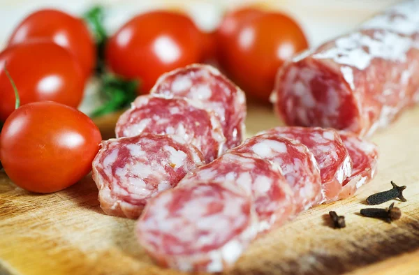 Sausage and tomatoes — Stock Photo, Image