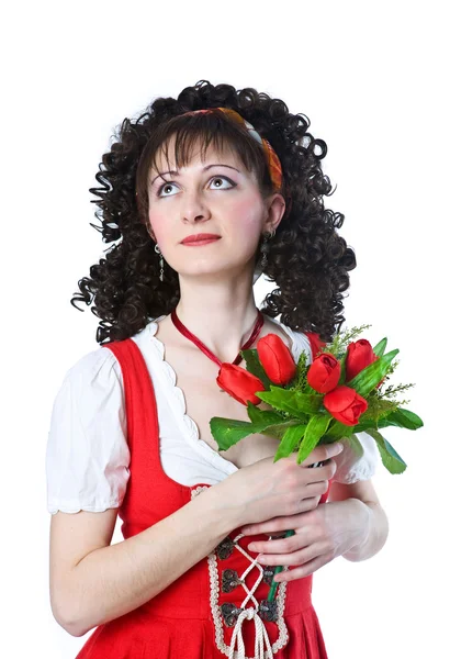 Vacker kvinna i röd klänning med blommor — Stockfoto