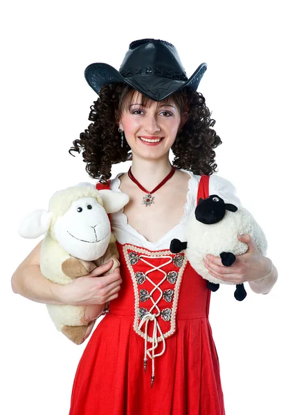 Schöne Frau mit Cowboyhut und Spielzeug — Stockfoto