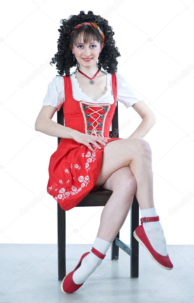 Coquettish woman sitting on chair