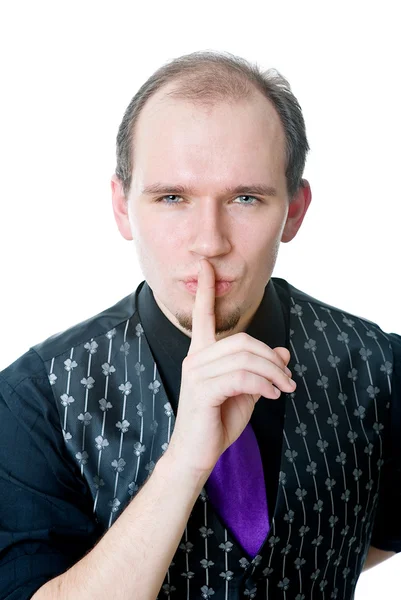 Homem segurando um dedo em seus lábios — Fotografia de Stock