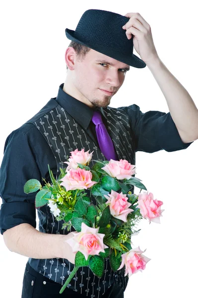Man in black hat with bouquet — Stock Photo, Image