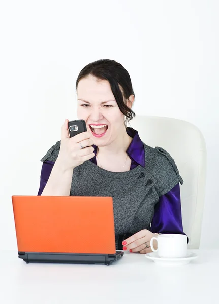 Angry business woman screaming with phone — Stock Photo, Image
