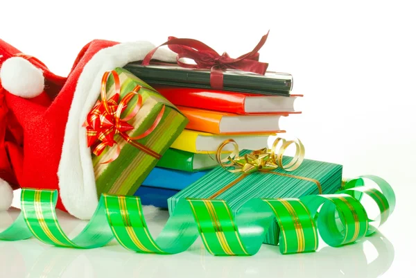 Christmas presents with e-book reader and books in bag against white backgr — Stock Photo, Image