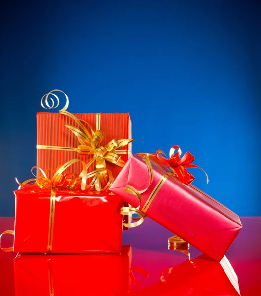 Christmas presents against blue background — Stock Photo, Image
