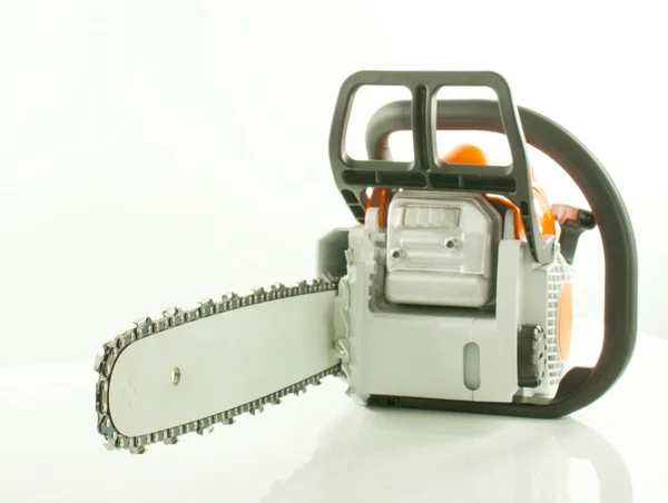 Chainsaw over the white background — Stock Photo, Image