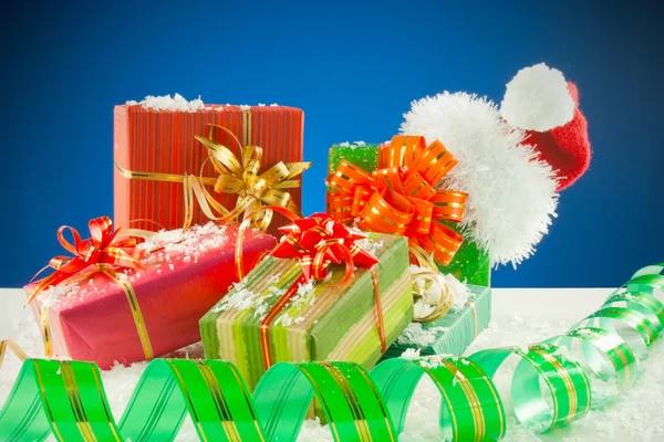 Christmas presents against blue background — Stock Photo, Image