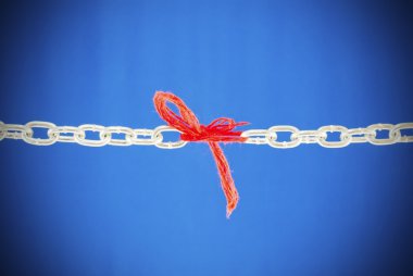 Broken chain connected with red threads clipart