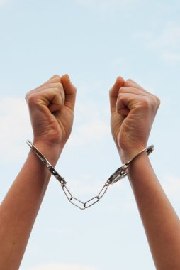 Handcuffed woman's hands clipart