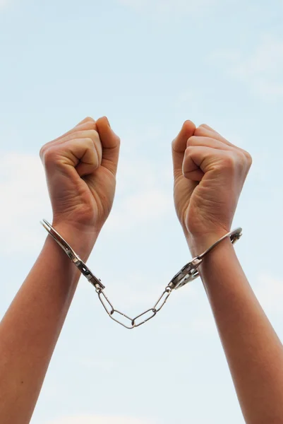 Handcuffed woman's hands — Stock Photo, Image
