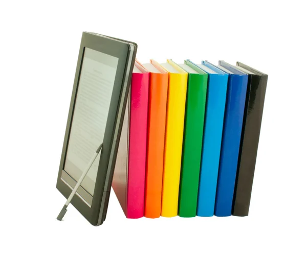 Pilha de livros coloridos e leitor de livros eletrônicos — Fotografia de Stock