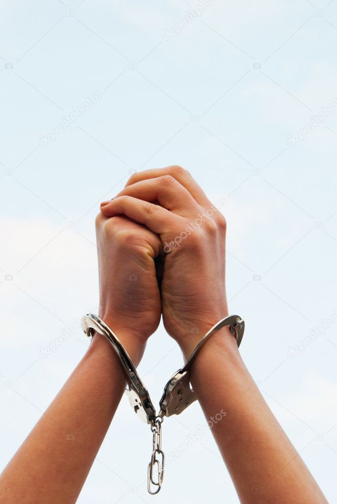 Hands handcuffed