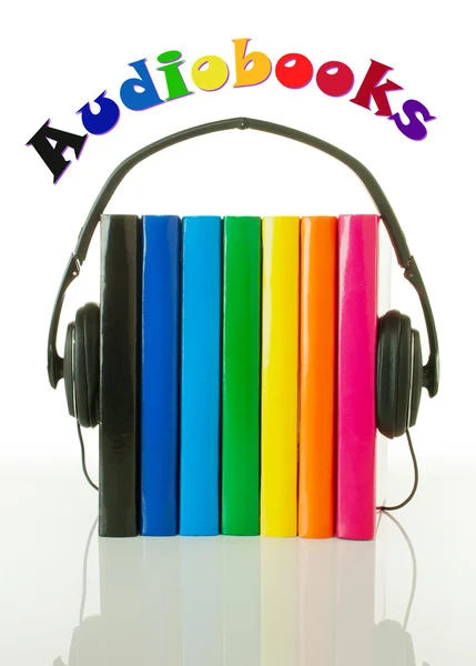 stock image Row of books and headphones - Audiobooks concept