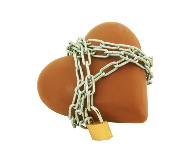 Heart shaped chocolate tied up with chains — Stock Photo, Image