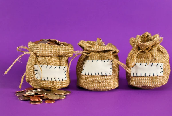 Three sacks full of coins — Stock Photo, Image