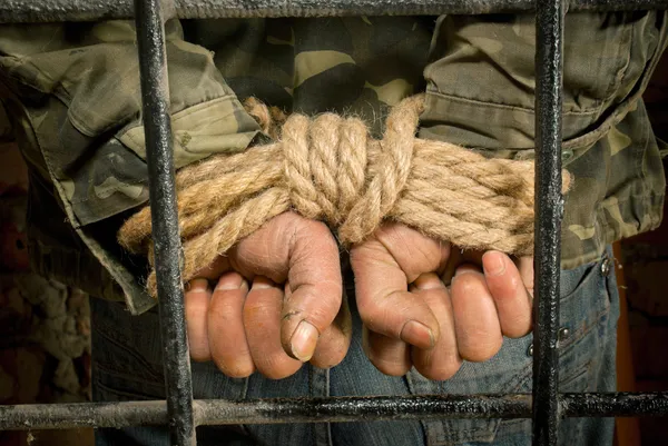 Man with hands tied up with rope — Stock Photo, Image