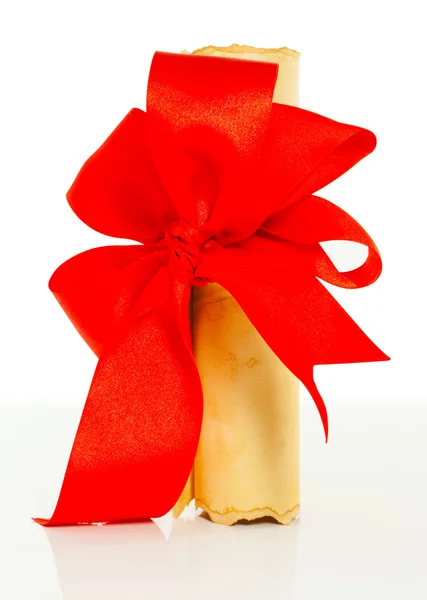 Ancient scroll tied up by red ribbon — Stock Photo, Image