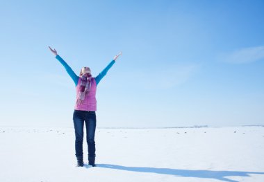 Teen girl staying with raised hands clipart