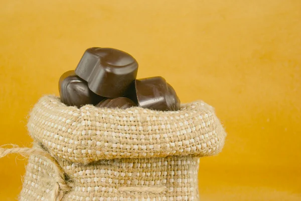 Close up of the sack full of chocolate candies — Stock Photo, Image