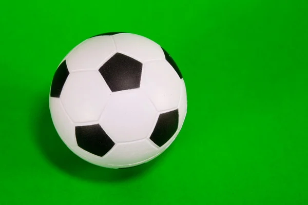 stock image Small soccer ball over green background