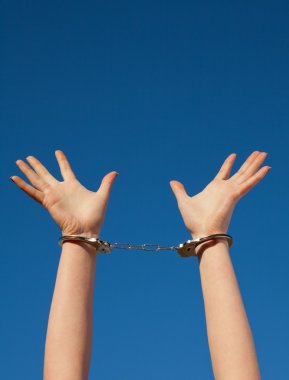 Handcuffed woman's hands clipart