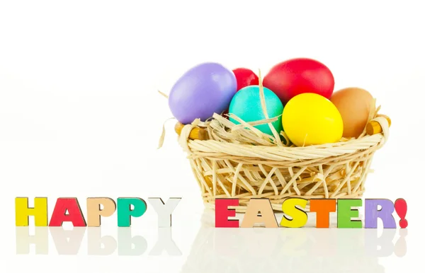 Basket with the colorful Easter eggs — Stock Photo, Image